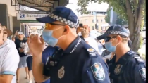 Thumbnail for In Australia, a group of people created a human barricade to defend a business that serves all, regardless of vaccination status.