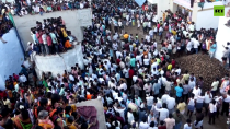 Thumbnail for Indians celebrate Ugadi festival by participating in cow dung fight