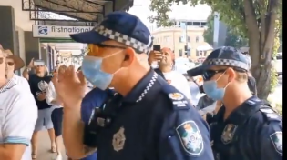 Thumbnail for In Australia, a group of people created a human barricade to defend a business that serves all, regardless of vaccination status.